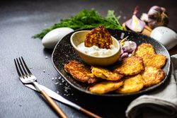 Traditional Ukrainian dish deruny with dipping sauce