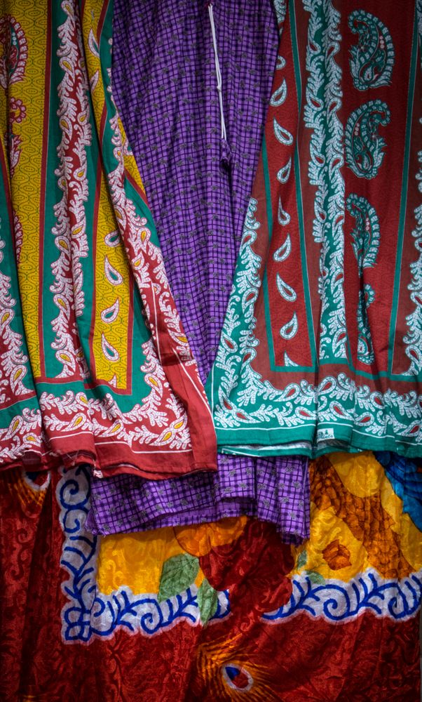 Close up of brightly patterned scarves