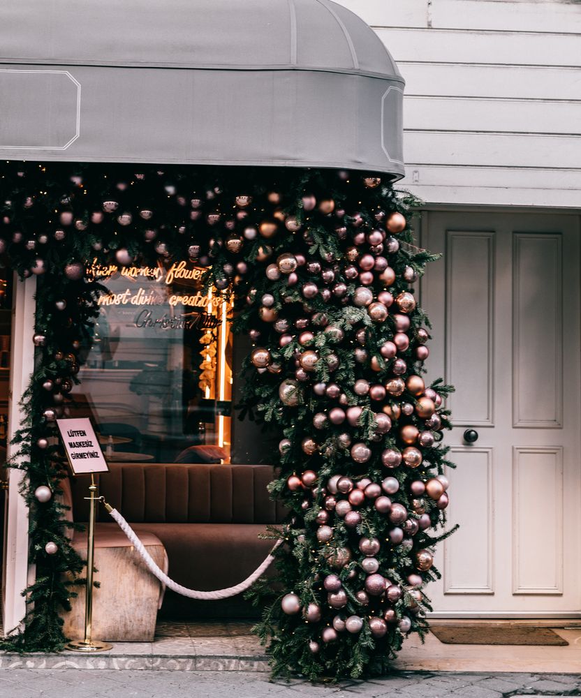 Restaurant front decorated with Christmas baubles