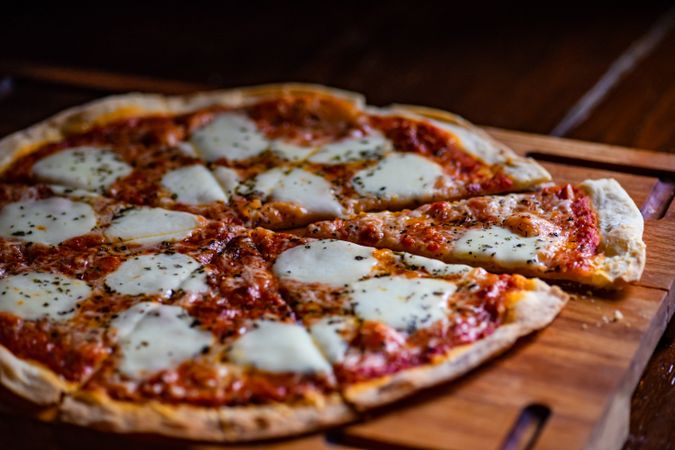 Freshly baked Italian pizza on board