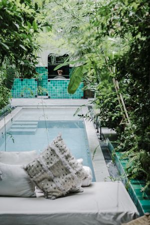 Soft bench near pool in garden