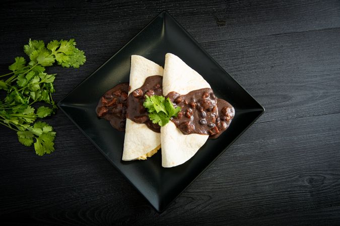 Veracruz eggs wrapped in tortillas decorated with sauce