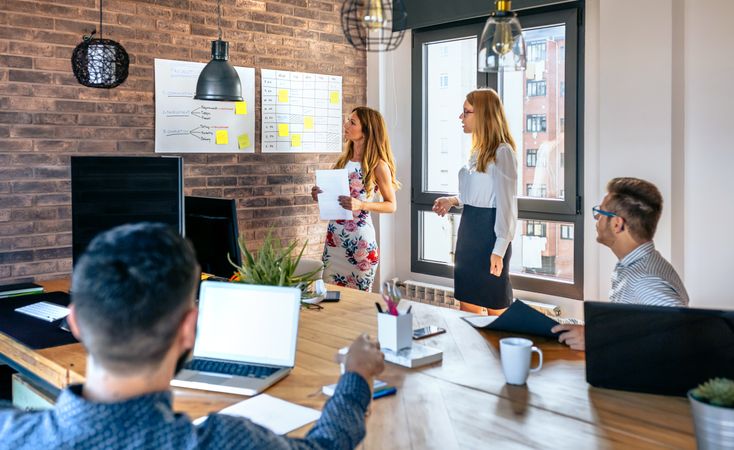 Coworkers in a meeting worried about bad results