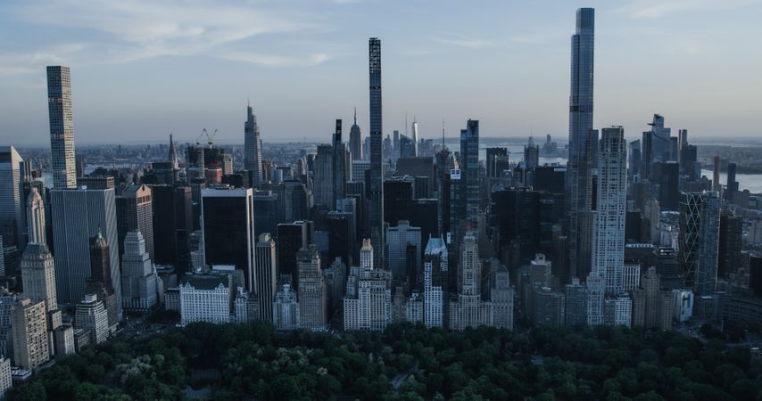 Scenic Aerial New York City View From Midtown Towards Lower Manhattan Architecture. Panoramic Wall Street Financial District Shot from a Helicopter. Cityscape with Office Buildings and Skyscrapers