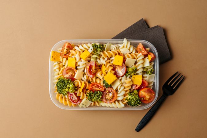 Lunchbox with pasta and plastic fork