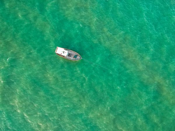 Top view of boat in clear waters