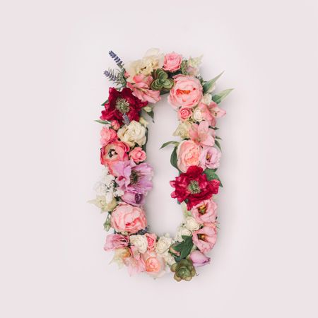 Letter O or number 0 made of real natural flowers and leaves