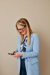 Woman at work reading texts on break at work