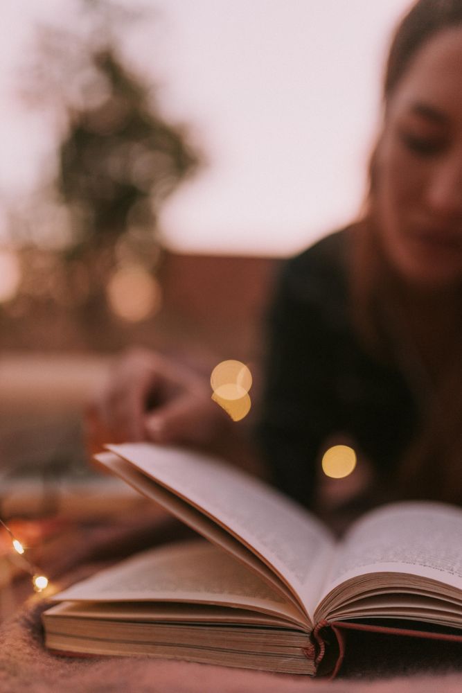 Woman in blurr reading book