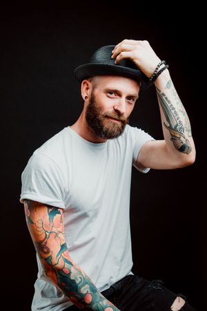 Smiling young guy in hat