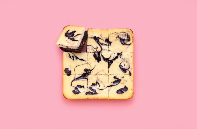 Cheesecake brownie above view isolated on a pink background
