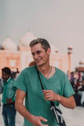 Smiling man in t-shirt on street