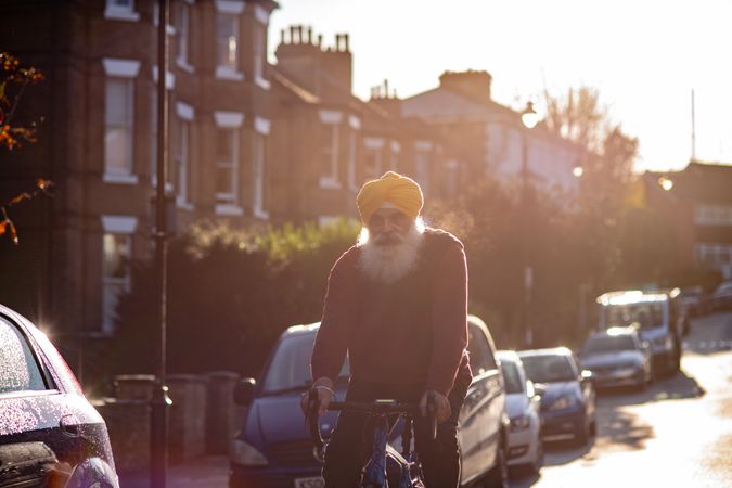 Sikh man cycling through British town