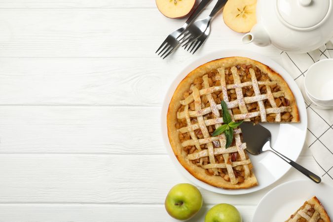 Composition with apple pie on wooden background. Tasty lunch. Homemade breakfast