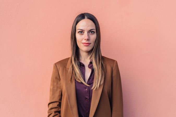 Pleased female in stylish outfit