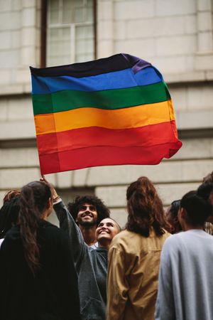 People participating in pride march in the city
