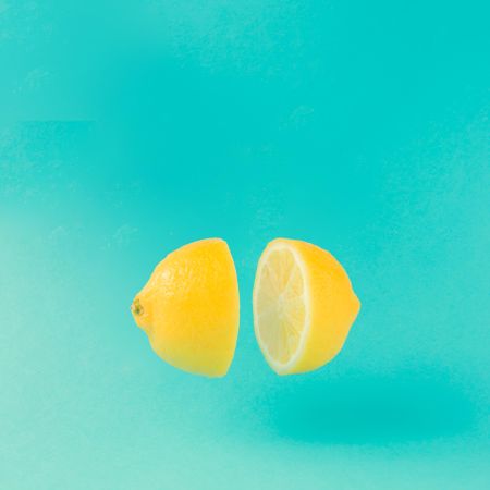 Lemon halved on bright blue background
