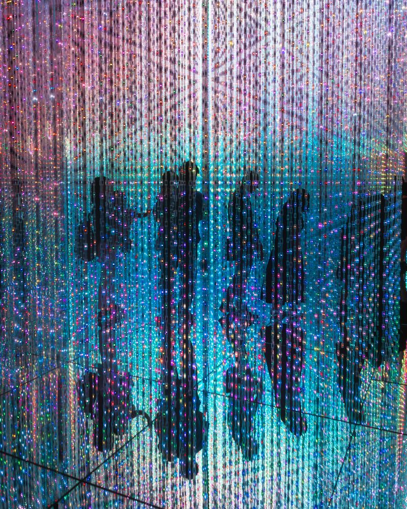 Silhouette of group of people on colored wall