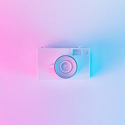 Vintage camera in vibrant bold gradient purple and blue holographic colors