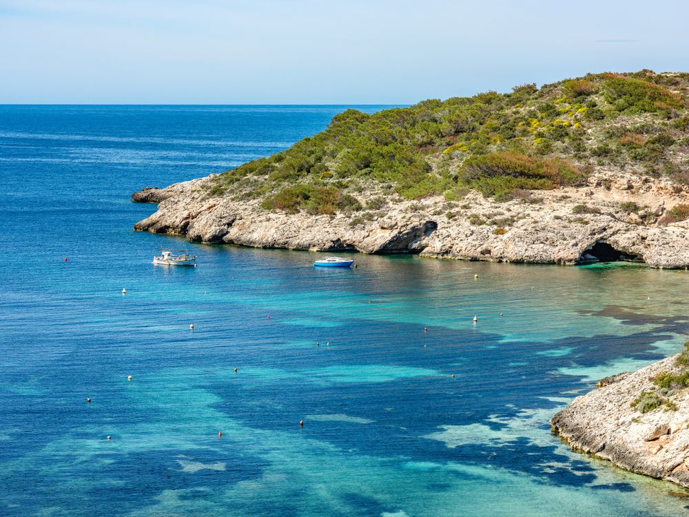 Cala Portinax bay with beautiful azure blue sea water
