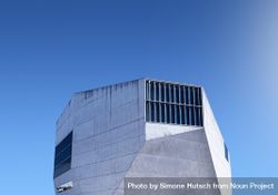 Uniquely shaped building against a blue sky 0JZdn0