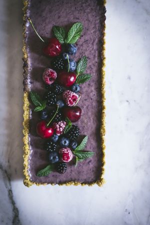 Fresh blueberry pistachio cake with whole berries on top