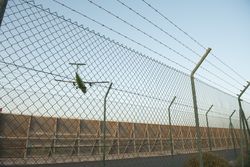 Plane behind security fence
