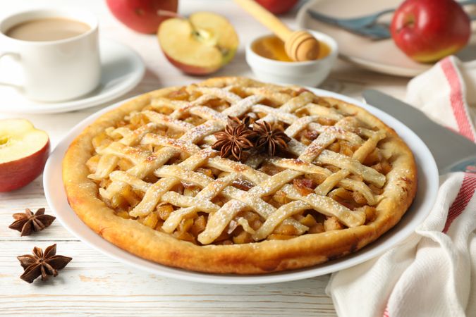 Composition with apple pie and ingredients on wooden background. Homemade food