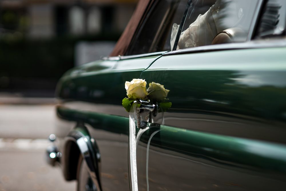 Delicate details of the wedding celebration. Newlyweds hold hands.