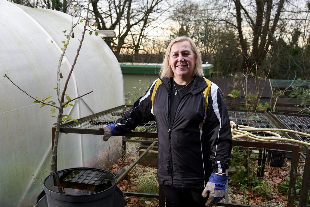 Older woman gardening outside