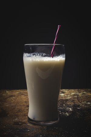 Glass of milk on table