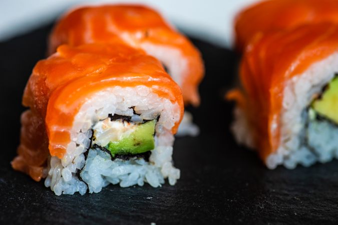 Sushi rolls with salmon & avocado with copy space