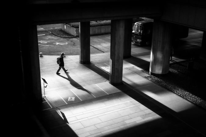 High angle view of man walking on sidewalk