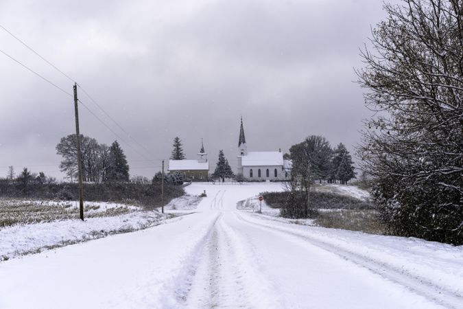 Churches at the end of a snowy road