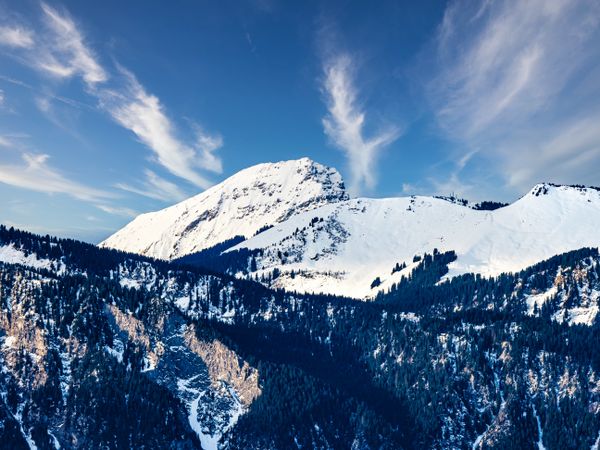 Swiss Alps winter landscape with snow and sun, mountains in Europe