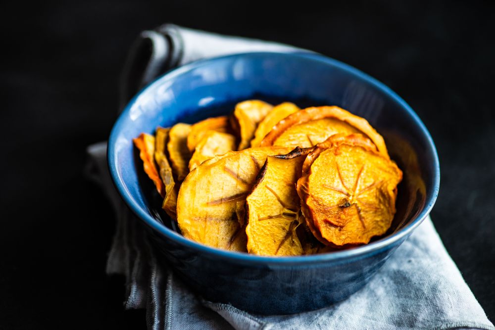 Blue bowls of dried persimmon slices