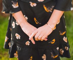 Cropped image of woman wearing dark floral dress bY7VN5