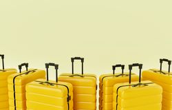 Yellow hard shell roller suitcases in a pastel yellow room