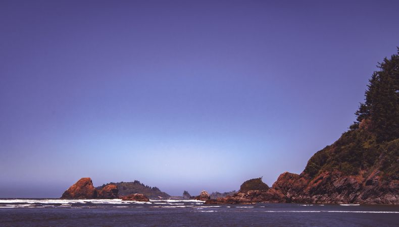 Side view of west coast cliffs on a clear day with blue sky