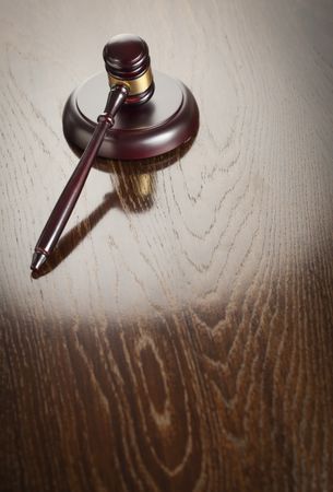 Wooden Gavel Abstract on Reflective Table