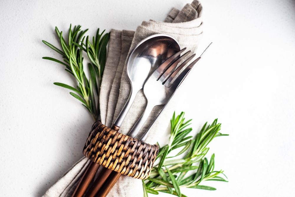 Cutlery set with fresh rosemary sprig