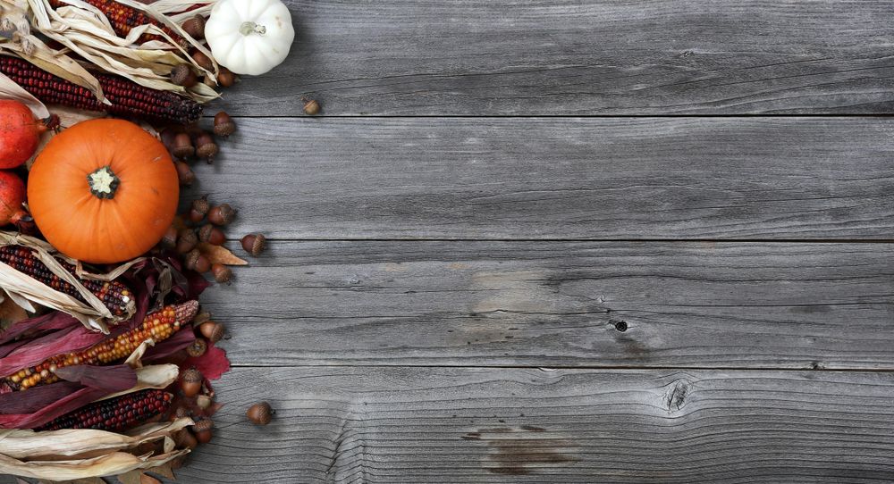 Left border of seasonal Autumn decorations on old wood for the holidays
