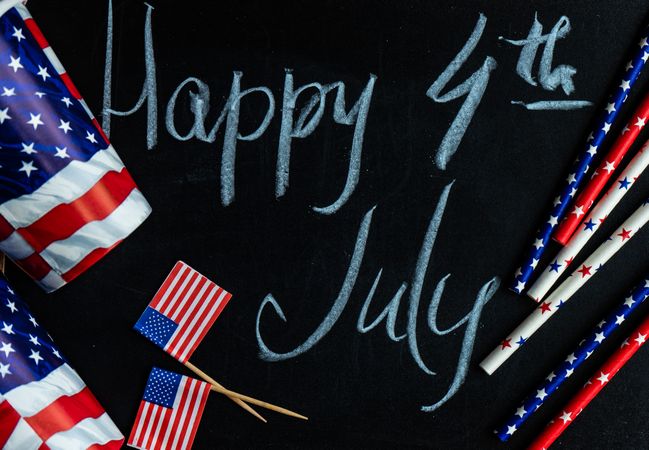 Looking down at chalkboard with the words "Happy 4th of July" surrounded by American flags