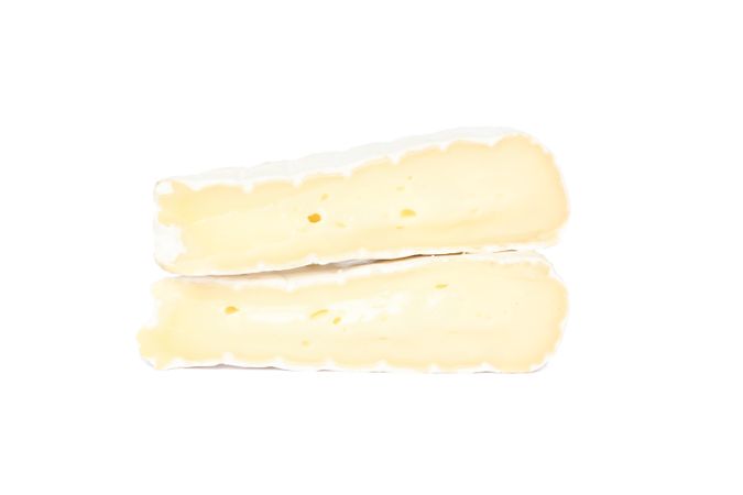 Pieces of camembert isolated on plain background