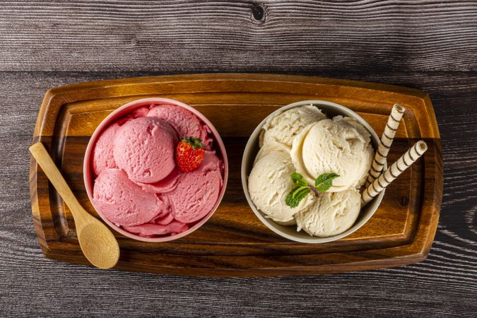 Bowls with strawberry and vanilla ice cream.
