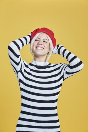 Happy young female in red beret