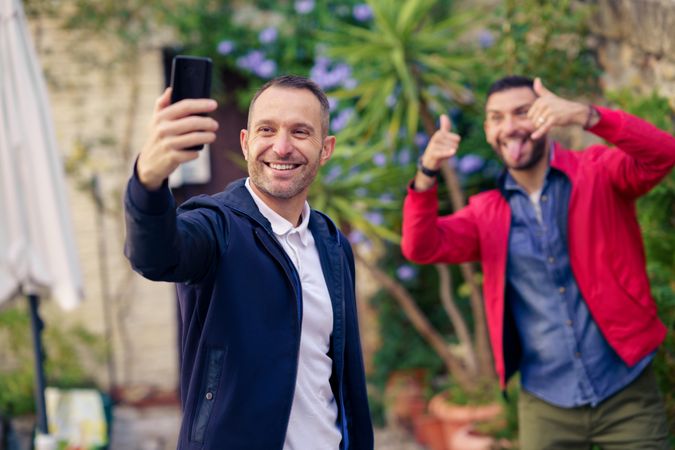 Two males making faces for fun selfie