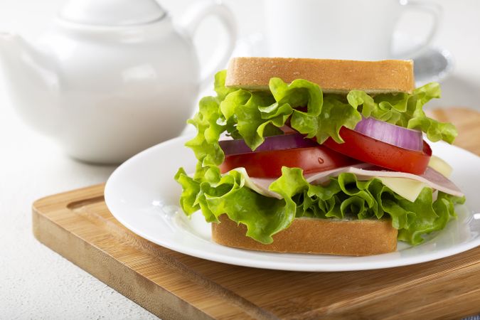 Natural sandwich. Sandwich with cheese, ham, lettuce, tomato and red onion.