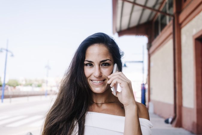 urban woman talking on mobile phone at street