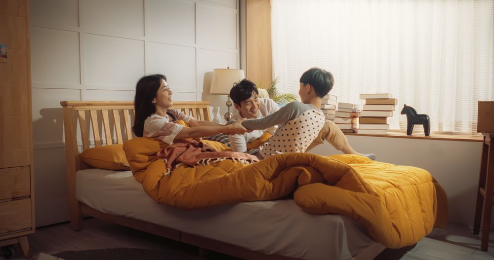 Active and Playful Child Waking His Parents Up to Face a New Day.